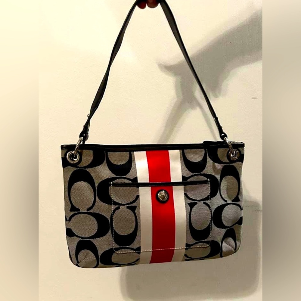 Coach canvas purse. Black C logo with red and white stripe.